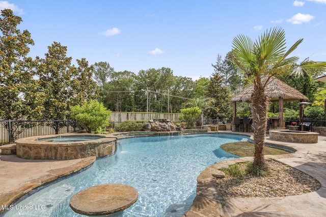 430 Johnstone Dr, Madison, MS 39110 - view of pool featuring a gazebo, a pool with connected hot tub, a fenced backyard, and a patio area