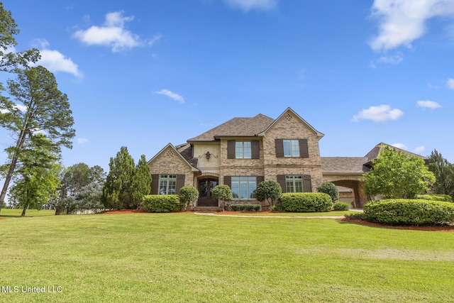 430 Johnstone Dr, Madison, MS 39110 - view of front facade featuring a front yard, brick siding, and a shingled roof