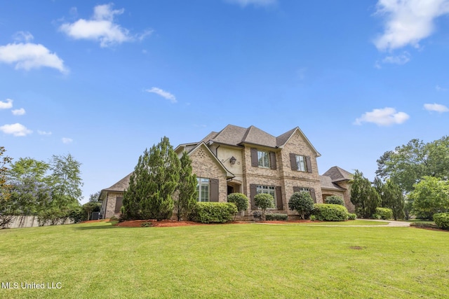 430 Johnstone Dr, Madison, MS 39110 - view of front of house with a front lawn, brick siding, and an attached garage