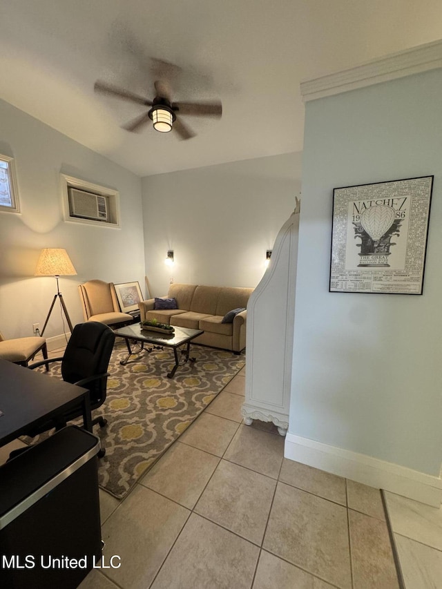 tiled living room featuring an AC wall unit and ceiling fan