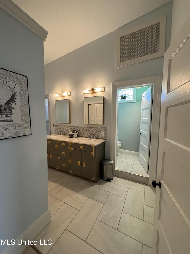 bathroom with tile patterned floors, vanity, and toilet