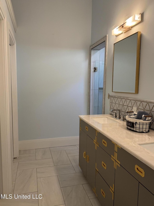 bathroom with vanity, backsplash, and tile patterned floors