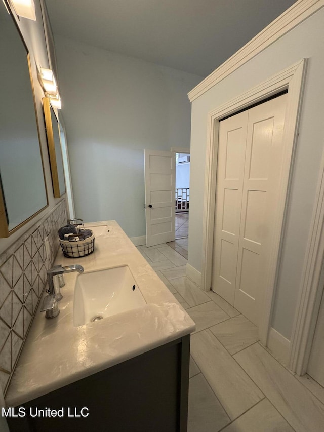 bathroom featuring backsplash and vanity