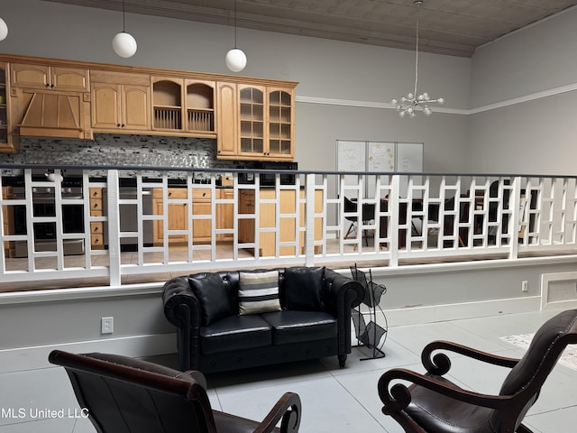 living room featuring a notable chandelier and light tile patterned floors