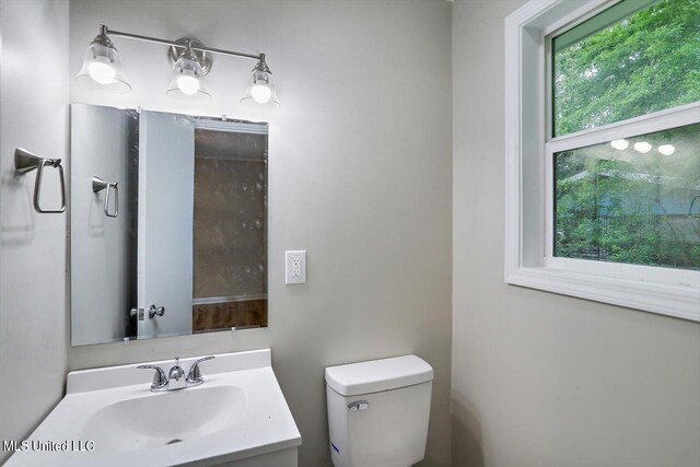 bathroom with vanity and toilet