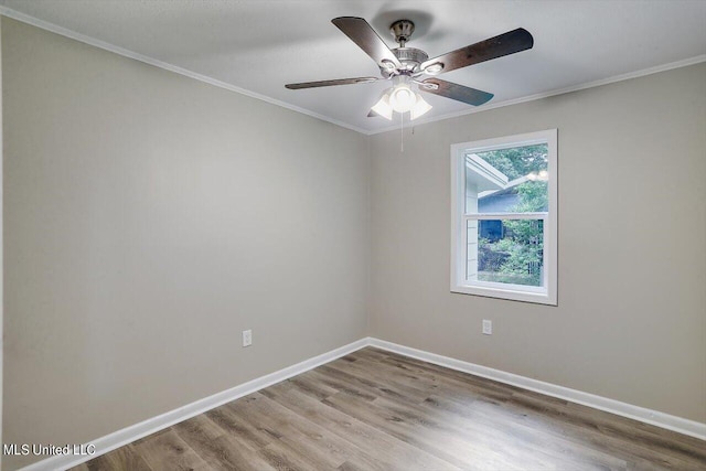 unfurnished room with ornamental molding, hardwood / wood-style floors, and ceiling fan