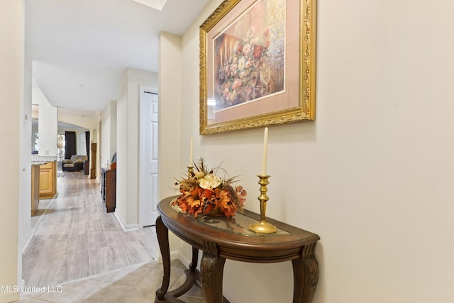 hall with light tile patterned flooring