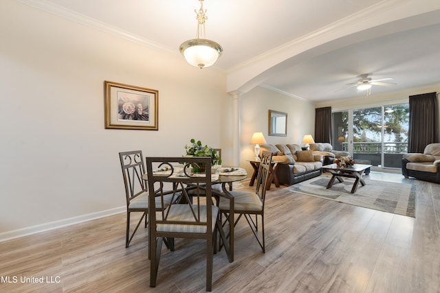 dining area featuring ornamental molding, ceiling fan, ornate columns, and light hardwood / wood-style flooring