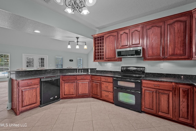 kitchen featuring vaulted ceiling, sink, black appliances, pendant lighting, and an inviting chandelier