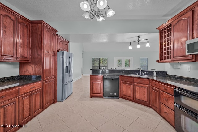 kitchen featuring sink, an inviting chandelier, pendant lighting, a textured ceiling, and black appliances