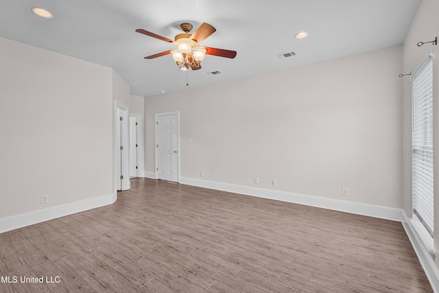 unfurnished room with light hardwood / wood-style flooring and ceiling fan