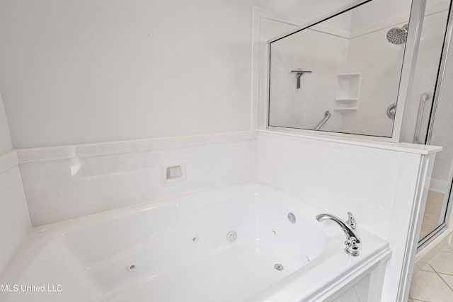 bathroom with tile patterned floors and independent shower and bath