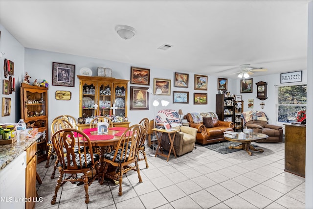 tiled dining room with ceiling fan