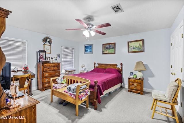 bedroom with ceiling fan and light colored carpet