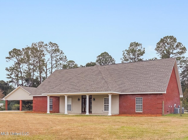 view of front of house featuring a carport, cooling unit, covered porch, and a front lawn