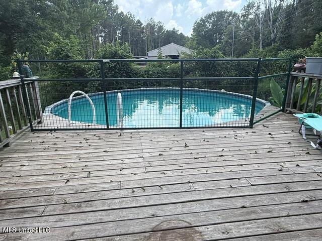3833 Cooperville Rd, Pelahatchie, MS 39145 - view of swimming pool with a deck