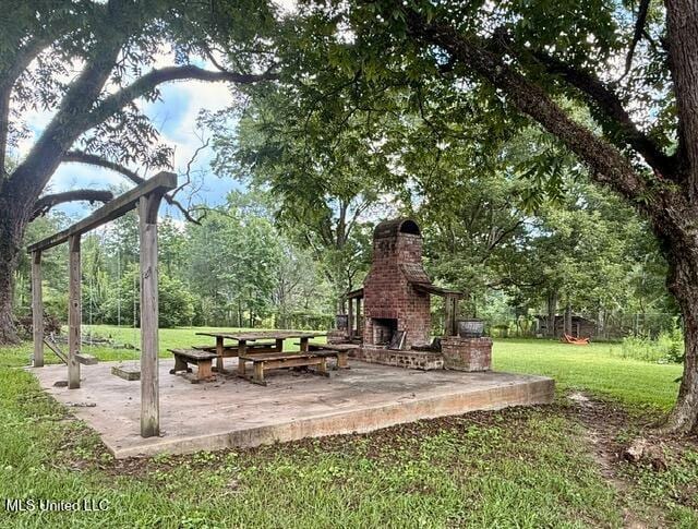 3833 Cooperville Rd, Pelahatchie, MS 39145 - view of home's community with a patio and a lawn