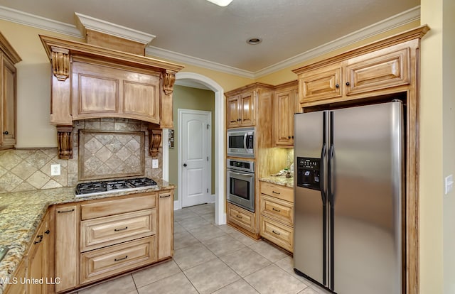 718 Tortoise Rdg, Brandon, MS 39047 - kitchen with appliances with stainless steel finishes, tasteful backsplash, light tile patterned floors, light stone counters, and crown molding