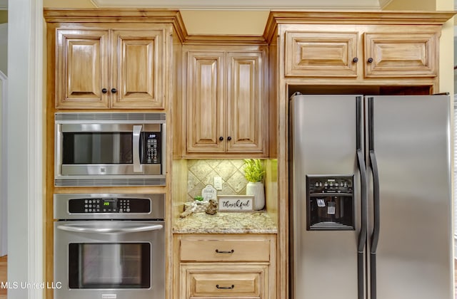 718 Tortoise Rdg, Brandon, MS 39047 - kitchen with appliances with stainless steel finishes, tasteful backsplash, and light stone countertops