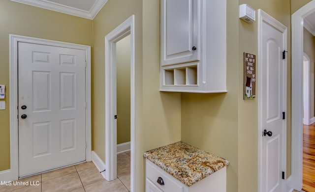 718 Tortoise Rdg, Brandon, MS 39047 - mudroom with ornamental molding, light tile patterned flooring, and baseboards