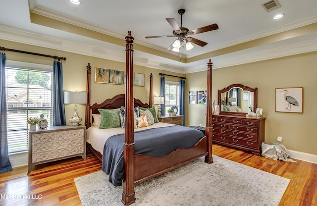 718 Tortoise Rdg, Brandon, MS 39047 - bedroom with wood finished floors, crown molding, a raised ceiling, a ceiling fan, and recessed lighting