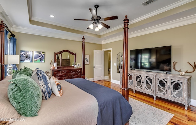 718 Tortoise Rdg, Brandon, MS 39047 - bedroom with a tray ceiling, crown molding, wood finished floors, baseboards, and recessed lighting