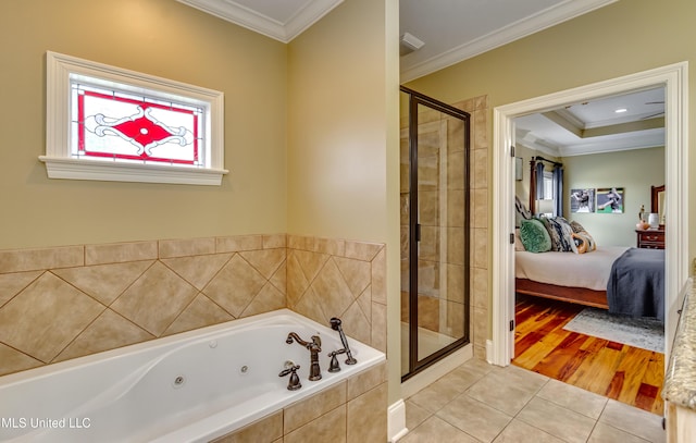 718 Tortoise Rdg, Brandon, MS 39047 - full bathroom featuring ensuite bath, crown molding, a whirlpool tub, a shower stall, and tile patterned flooring