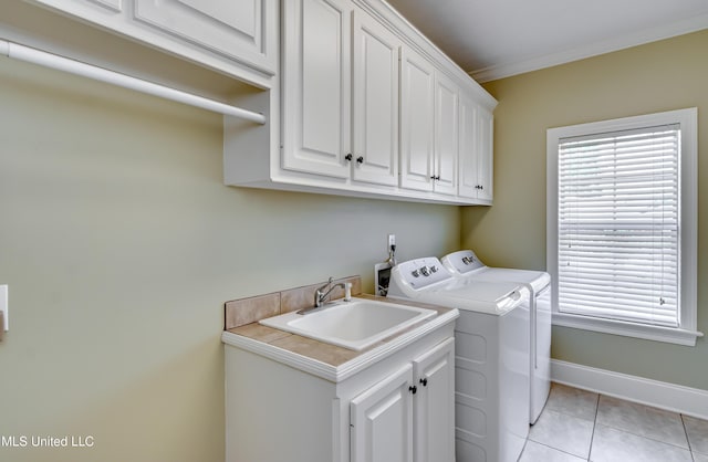 718 Tortoise Rdg, Brandon, MS 39047 - washroom featuring cabinet space, independent washer and dryer, light tile patterned flooring, baseboards, and ornamental molding