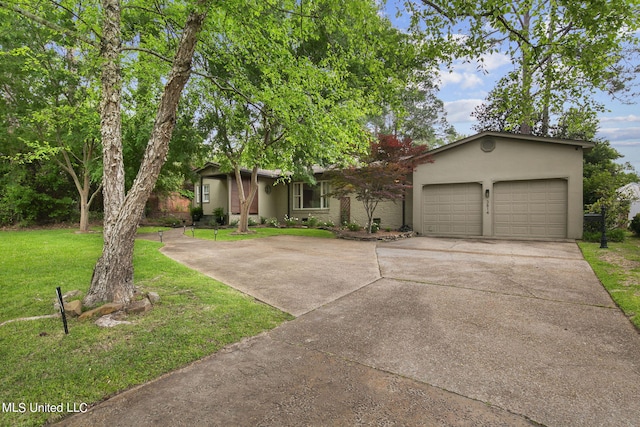 ranch-style house featuring a front yard and a garage