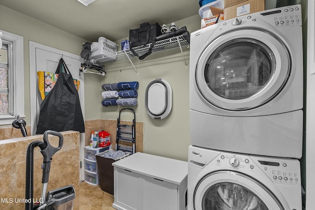 laundry area with stacked washer and dryer