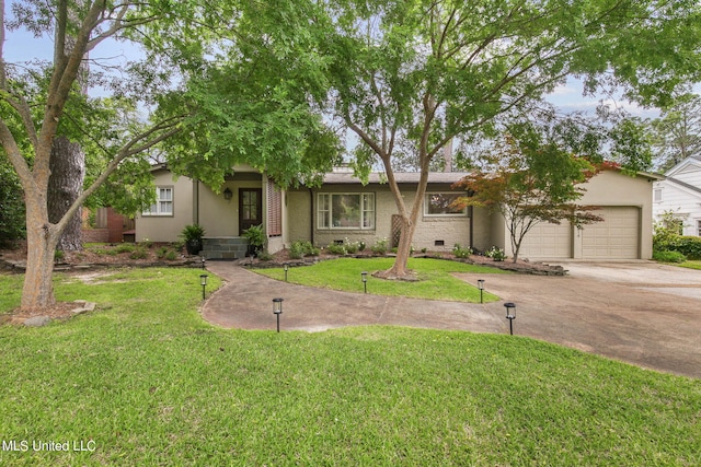 view of front facade with a front lawn and a garage