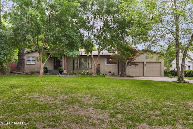 ranch-style home featuring a front yard and a garage