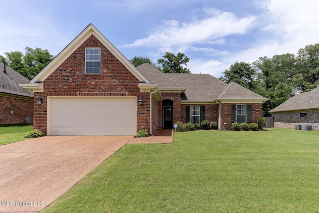 2634 Harvest Tree Dr, Southaven, MS 38672 - view of front facade with a front lawn, brick siding, concrete driveway, a garage, and a shingled roof
