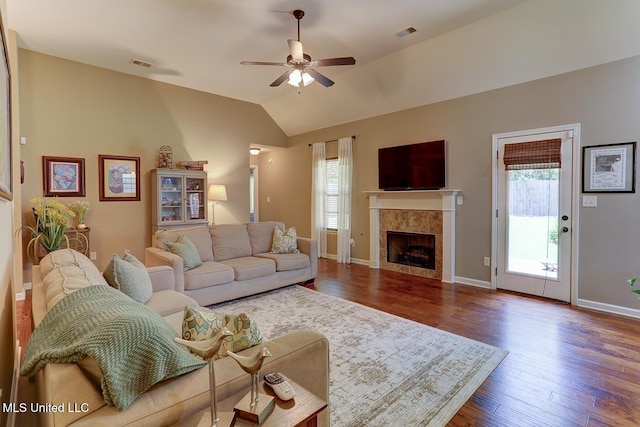 2634 Harvest Tree Dr, Southaven, MS 38672 - living room with plenty of natural light, ceiling fan, a fireplace, lofted ceiling, and dark wood-style floors
