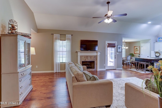 2634 Harvest Tree Dr, Southaven, MS 38672 - living area with lofted ceiling, plenty of natural light, wood finished floors, and a tile fireplace