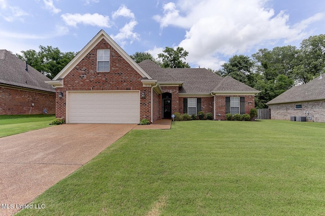 2634 Harvest Tree Dr, Southaven, MS 38672 - traditional-style home with brick siding, a front lawn, driveway, and a shingled roof