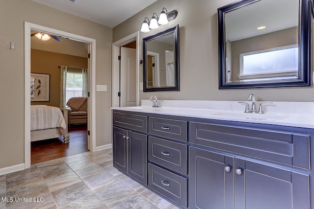 2634 Harvest Tree Dr, Southaven, MS 38672 - bathroom featuring double vanity, ensuite bath, and ceiling fan