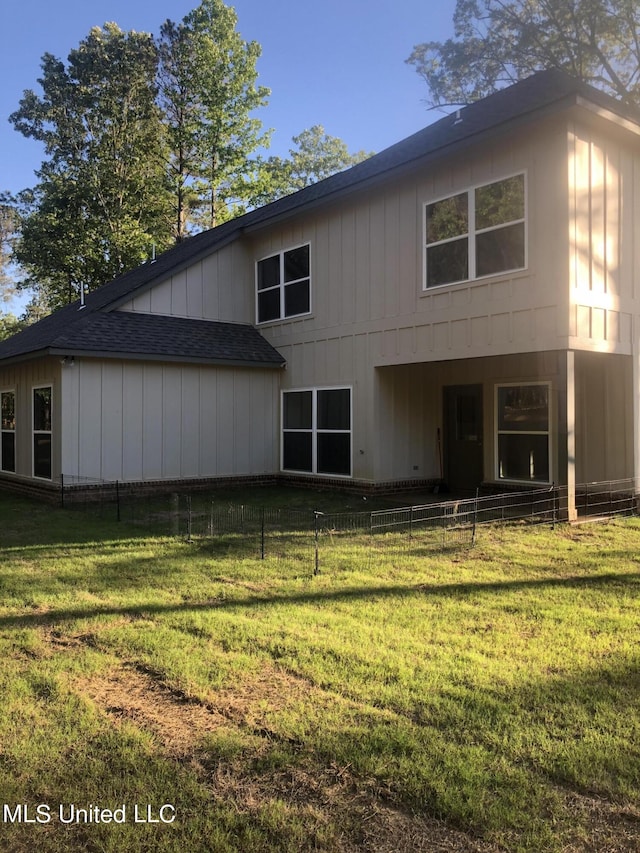 119 Whitetail Ln, Coldwater, MS 38618 - rear view of house with a shingled roof and brick siding