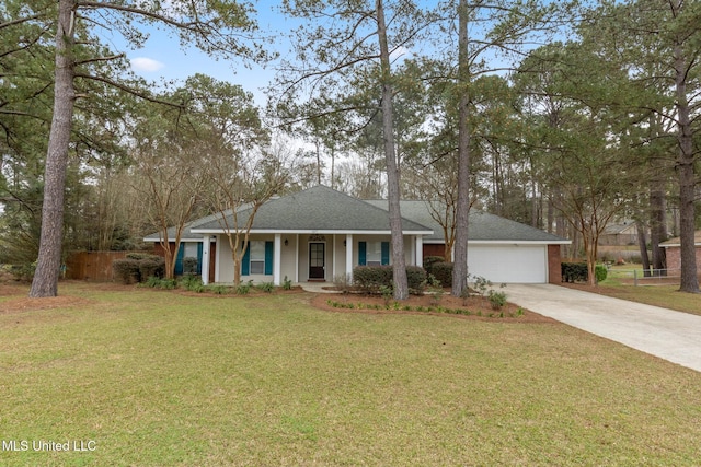 single story home with a front yard, an attached garage, covered porch, and driveway