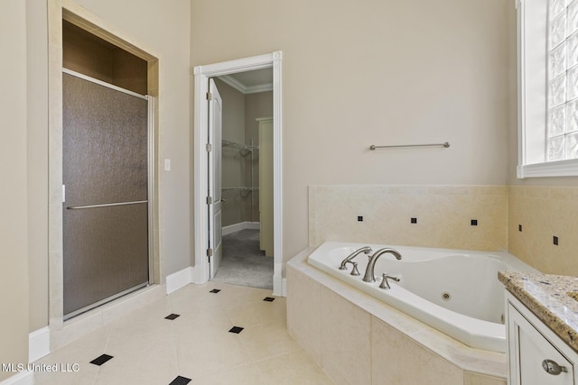 bathroom featuring vanity, tile patterned floors, ornamental molding, and shower with separate bathtub