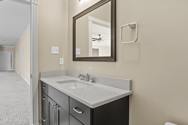 bathroom featuring ornamental molding and vanity