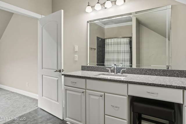 bathroom featuring vanity, crown molding, tile patterned floors, and walk in shower