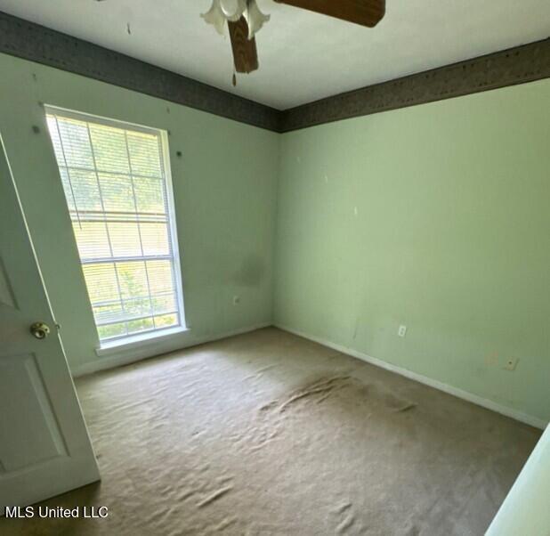 5 Union Church Rd, Tylertown, MS 39667 - carpeted spare room with a ceiling fan and baseboards