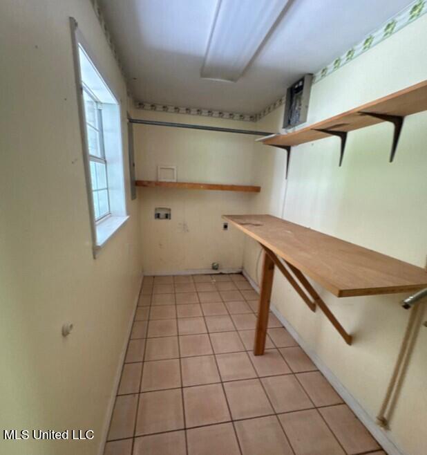 5 Union Church Rd, Tylertown, MS 39667 - laundry area featuring hookup for a washing machine, electric dryer hookup, and light tile patterned floors