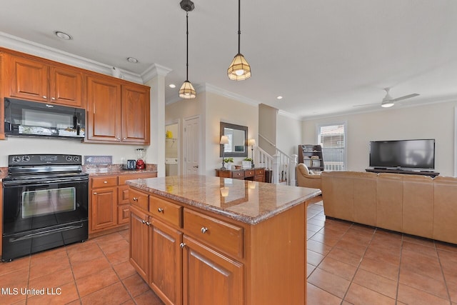 kitchen with light stone countertops, pendant lighting, black appliances, a kitchen island, and ceiling fan