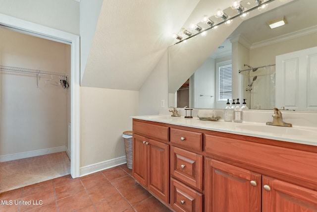 bathroom featuring a shower, crown molding, vanity, and tile patterned flooring