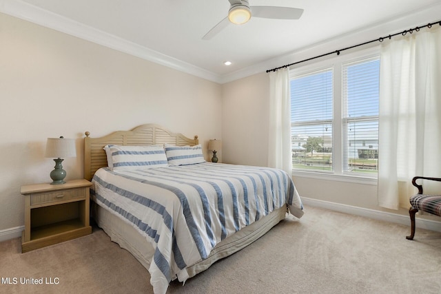 carpeted bedroom with ceiling fan and crown molding