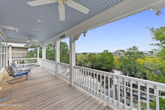 wooden deck with ceiling fan