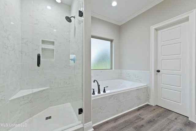 bathroom featuring hardwood / wood-style floors, separate shower and tub, and crown molding