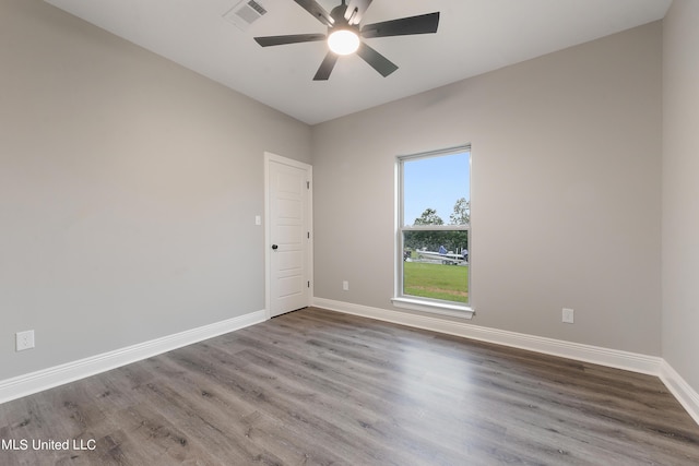 spare room with wood-type flooring and ceiling fan